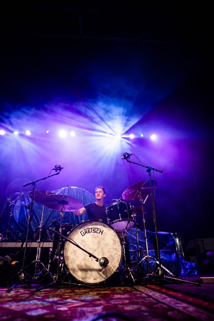 Garrett Hawkins playing drums on stage